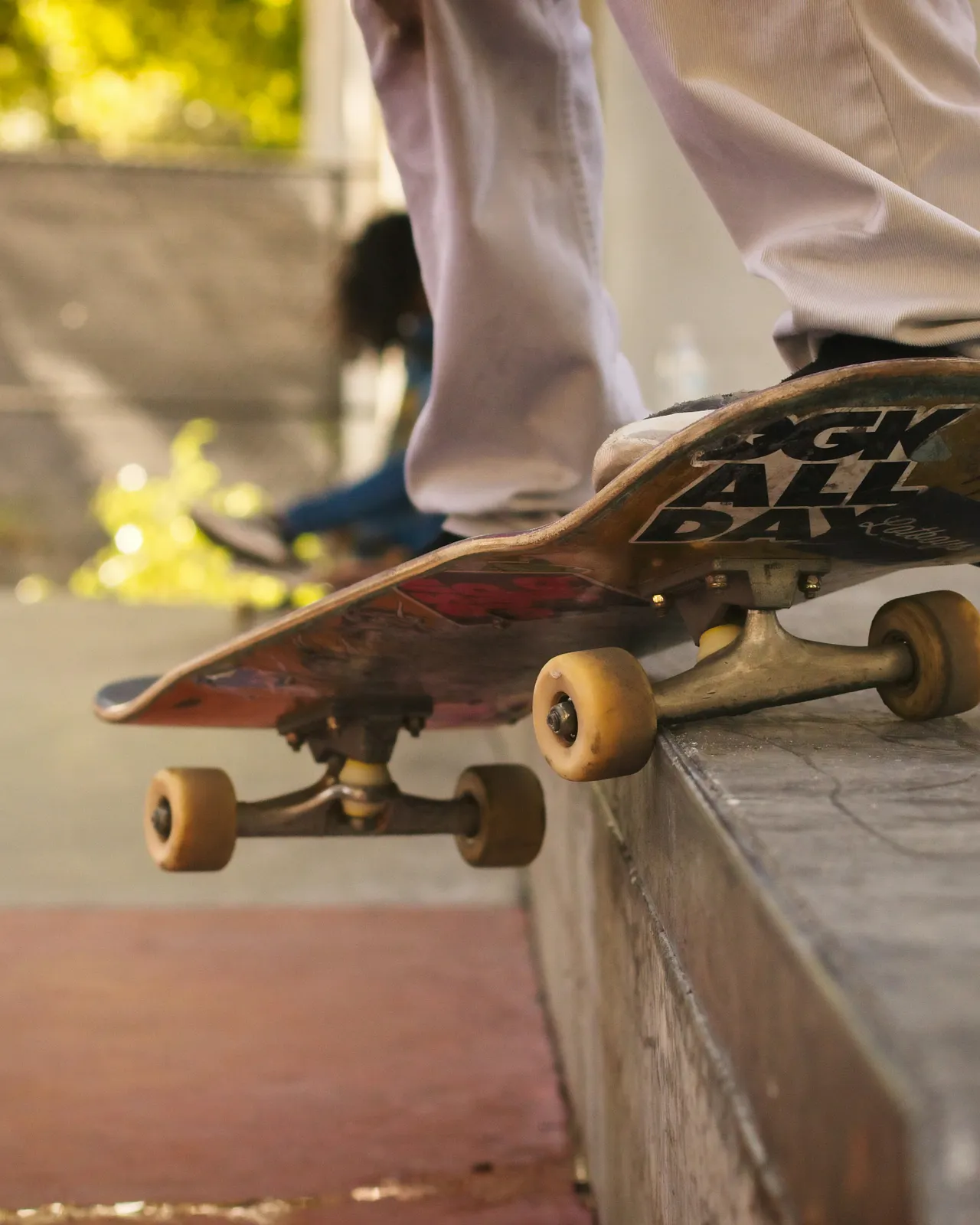 Skateboarder performing a 50-50 grind